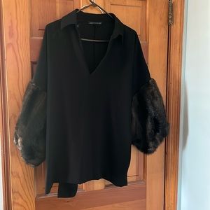 Zara woman blouse with faux fur sleeves. Can be dressed up or dressed down.